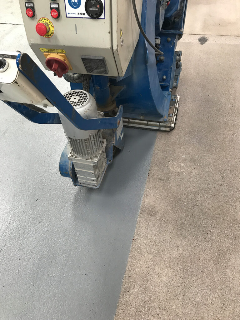 concrete-floor-paint-services applying non-slip floor paint